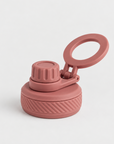 A dusty rose silicone water bottle lid with a flip-up carrying loop, shown on a clean white background.